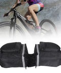 25L Bike Rack Bag For Rear Carrier Double Pannier Trunk Storage With Side Pockets Mountain Road Ready Tote For Adults Ideal For Groceries And Tools For Everyday Commutes in black, displayed with a cyclist in the background.