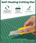 Self Healing Cutting Mat 23 By 35 Inches Large Double-Sided Rotary Cutting Mat For Sewing, Quilting, Scrapbooking, Fabric And Craft Projects With Clear Grid Lines, Angles And Guides, Green A1 with hand holding a cutter