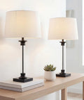 Two Pack 30 Inch Table Lamps In Black And Clear Glass With Metal Column Base And White Linen Drum Shade, Classic Iron Look, LED Bulbs Included, ETL Listed For Safe Living Room Or Bedroom Lighting.