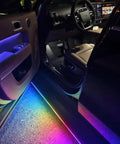 Plug And Play Deployable Running Boards For Tesla Cybertruck with custom LED lights illuminating the interior entrance.