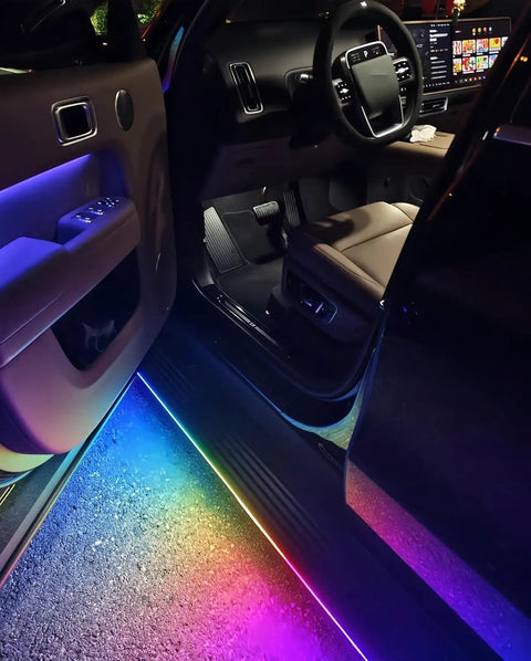 Plug And Play Deployable Running Boards For Tesla Cybertruck with custom LED lights illuminating the interior entrance.