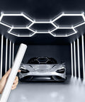 Five Grid Hexagon Garage LED Lights With 1.33 Inch Wide Eye Care Panel 25 Pack 26400 Lumens installed in a garage ceiling