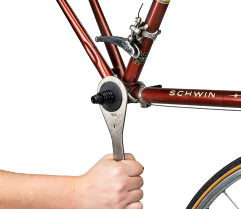 Bottom Bracket Retaining System With Double Sided Adapter Nut For Cartridge BBs being used on vintage bike