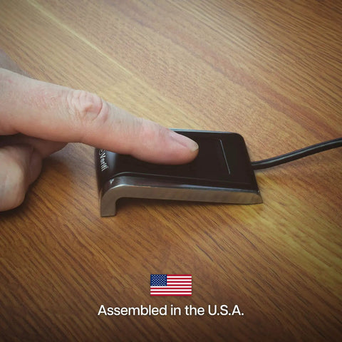 Person using Fast USB Fingerprint Reader For Windows Hello And Passkey Login No Fuss Biometric Security For Your PC on desk.