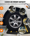 Rubber Curb Ramp Set For Driveway Two Pack with reflective safety strips under a car wheel with 33069 lbs load capacity.