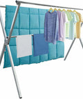 Premium Stainless Steel Clothes Drying Rack Adjustable Indoor Outdoor Length Folds Flat Saves Hella Space With Secure Windproof Hooks For Balcony Or Garage Featuring Snappy Setup And Bulletproof Build That Conquers Daily Grind holding colorful clothing and towels against a turquoise backdrop.