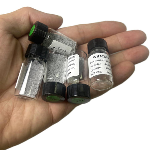 Five Bottle Leaded BGA Solder Balls Set With Twenty Five Thousand Per Bottle Sn63 Pb37 Reballing Tin Balls showcased on a hand