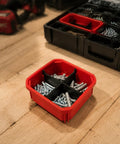 Packout Compatible Cross Divider Insert for Slim Bins containing screws on wooden surface.