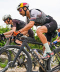 Cyclists riding on gravel road showcasing Endurance Formula Tubeless Bike Tire Sealant With Injector For MTB Road CX And Gravel Bikes