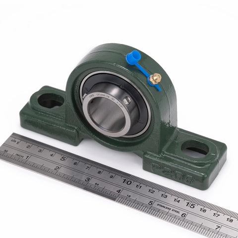 Pillow block bearing UCP206-18 on green cast-iron base with chrome sealed bearing and blue grease plug, 1-1/8 in bore.