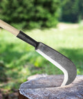22 Inch Steel Machete For Heavy Duty Yard Work And Tree Cutting Beast Ready with wooden handle on a tree stump outdoors