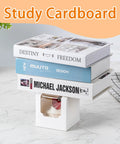 Books stacked on 50 Pack Cupcake Containers With Windows, Food Grade Cupcake Boxes With Lids, in a kitchen setting.