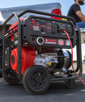 8,200 Watt Dual Fuel Portable Generator with 322cc OHV, CO Sensor, in outdoor setting next to truck