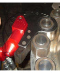 Zero Hassle Heavy Duty Hydraulic Torque Wrench 700 Bar Square Drive Rotary Return shown with red swivel hose near bolts.