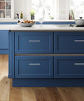 Modern kitchen with blue cabinets featuring 40 Pack Brushed Nickel Stainless Steel Kitchen Cabinet Handles Drawer Pulls, 5 Inch Length.