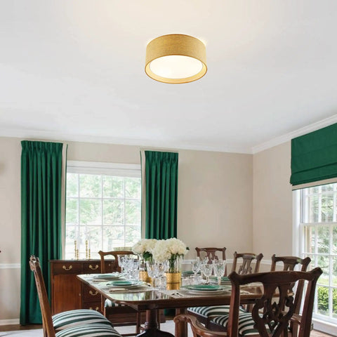 Modern 3 Light Flush Mount Ceiling Light with Fabric and Acrylic Double Drum Shade in flaxen over dining room.