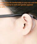 Close-up of Soft Silicone Eyeglass Ear Hooks 10 Pairs Clear Anti Slip Grips For Glasses shown installed on ear and temple arm.