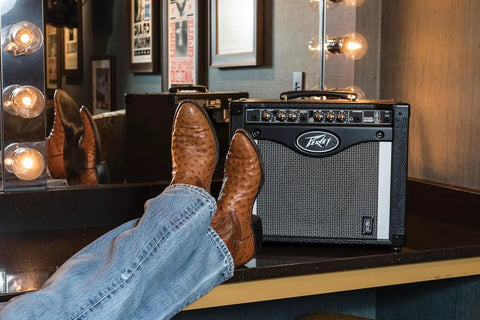 Rage 258 Guitar Combo Amp with 8 Inch Blue Marvel Speaker beside cowboy boots in a dressing room