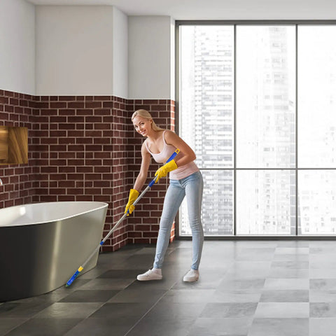Woman using Long Reach Grout Brush With Extendable Stainless Steel Handle For Floor To Wall Cleaning No Knees Back Saving Tile Scrub