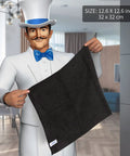 Person holding All Purpose Microfiber Cleaning Cloths Pack Of 12, Ultra Soft, Killer Streak Free And Scratch Free Rags, 32 x 32 cm, Black