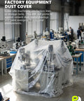 Massive Ultra Clear Painter Plastic Roll 9 By 400 Feet 0.31 Mil HDPE Sheeting covering machinery in a factory setting.