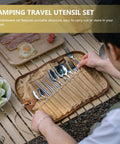 Person organizing Stainless Steel Camping Utensil Set With Spoon Fork Chopsticks All In One Travel Camp Kitchen Kit on table