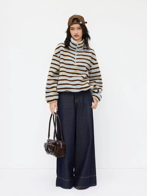 Model wearing Cozy Fleece Stripe Stand Collar Drawstring Half Zip Oversized Sweatshirt Sky Blue Medium with jeans