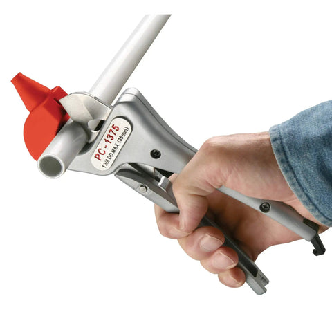 Close-up of Single Stroke Plastic Pipe Cutter for One Eighth to One and Three Eighths Inch cutting PVC pipe, hand holding tool