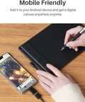 Compact Drawing Tablet With Slick Scroll Wheel And Ergonomic Stylus Delivering Sick Precision And Butter Smooth Pressure Response Perfect For Pc Artists Seeking Zero Lag Creativity And Hassle Free Setup In Sleek Black, shown with a connected smartphone.