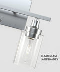 Close-up of Two-Light Vanity Light With Clear Ribbed Glass Shades And Nickel Finish For Bathroom Over Mirror Modern Industrial Chic Style E26