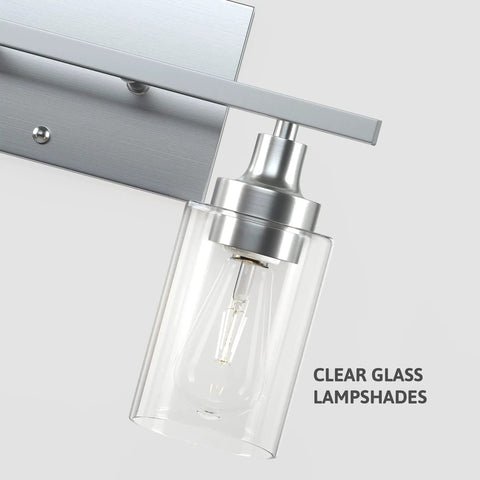 Close-up of Two-Light Vanity Light With Clear Ribbed Glass Shades And Nickel Finish For Bathroom Over Mirror Modern Industrial Chic Style E26