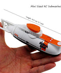 Super Cool RC Submarine Toy For Surface And Deep Water Diving held in hand, showing compact size and detail.
