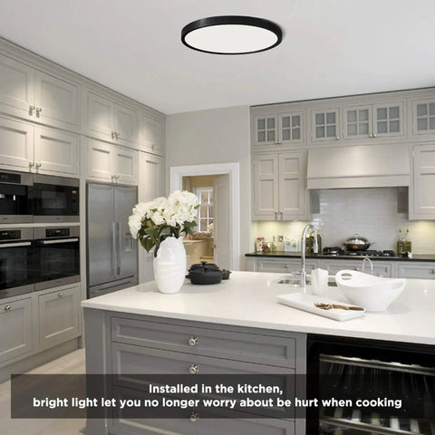 No Fuss Flush Mount LED Ceiling Light 18W 5000K Daylight in a modern kitchen setting with white cabinets and dining island.