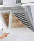 Range Hood Filter Sheets Nonwoven Fabric For Grease And Oil Protection Replacement Paper Roll Oil Proof Filter Paper Anti Oil Sticker White 10M Length Easy Install Durable Nonwoven Material For Cleaner Kitchen Vents installed on a range hood, showing oil absorption efficiency.
