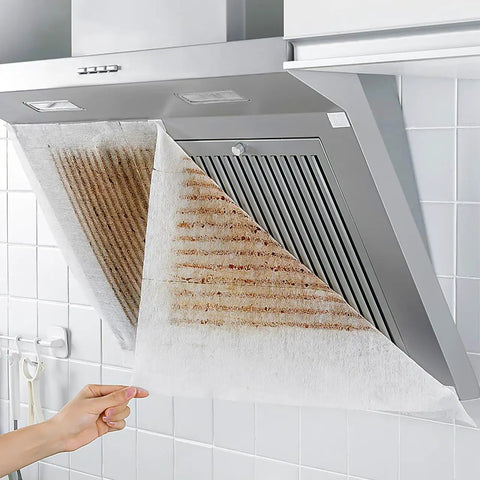 Range Hood Filter Sheets Nonwoven Fabric For Grease And Oil Protection Replacement Paper Roll Oil Proof Filter Paper Anti Oil Sticker White 10M Length Easy Install Durable Nonwoven Material For Cleaner Kitchen Vents installed on a range hood, showing oil absorption efficiency.