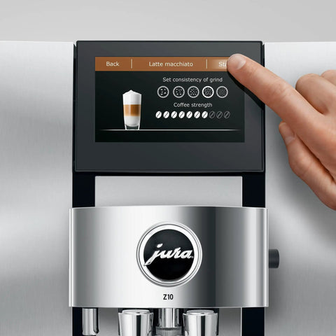 Person adjusting settings on automatic coffee machine with cold brew one touch brew and sweet hot specialty drinks 40 varieties.