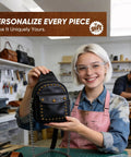 Person holding a black leather bag adorned with brass rivets, made using Leather Rivet Kit Pro Grade With 370 Brass Double Cap Rivets.