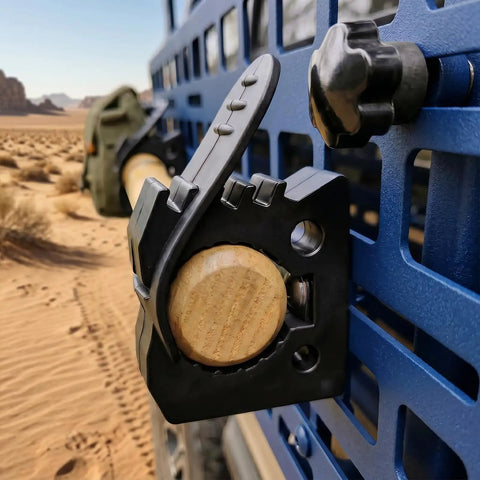 Close-up of 8 Piece Quick Release Shovel Holder Kit for Trucks and SUVs fits roof rack crossbars gripping wooden handle.