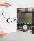 No Sweat Spring Fit Access Panel Covers Dreamy 8x8 Inch Drywall Cuts open, showing plumbing connections behind wall.