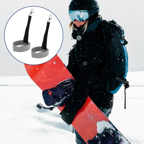 Snowboarder holding snowboard with image of Four Pack Ski Glove Leashes Made From Premium Nylon With Metal Button in grey shown