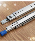 High Octane Heavy Duty Side Mount Ball Bearing Drawer Slides With Triple Extension Full Reach Cold Rolled Steel Cabinet Rails shown on wood.