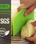 Person using green 3-Piece Flexible Dough Scraper Bench Set, 4.7x3.7 Inch Bowl Scraper With Sharp Edge And Angles, Non-Slip Bakeware Tool