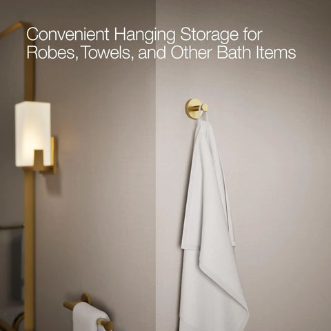 Elate Robe Hook In Vibrant Brushed Moderne Brass with white towel in bathroom for coordinating faucets and accessories