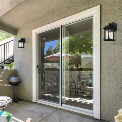 Patio with 2 Pack Black Outdoor Wall Lanterns For Front Porch And Exterior Spaces, Weatherproof Aluminum Sconce Lights, mounted beside sliding door.