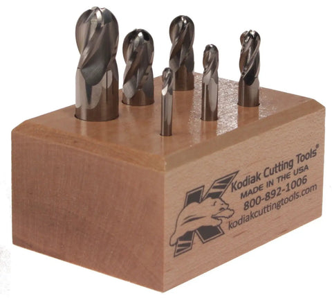 Made in USA Micrograin Carbide Ball Nose End Mill Set Built Tough for Precision on wood stand, six pieces visible