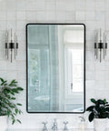Modern Two Light Crystal Wall Sconces Set Of Two In Black Glass Luxury Bathroom Wall Fixtures on tiled wall beside mirror.