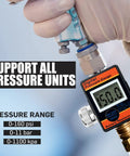 Close-up of LE LEMATEC digital air pressure regulator with LED display and 1/4 in NPT fitting.