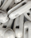 Close-up of glazed ceramic antenna insulators, showing 22 pack of small isolators for dipole, inverted Vee, end-fed, and long-wire antennas.