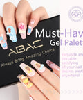 Hand with glossy nail designs using Pastel Shimmer Solid Gel Nail Polish Set With 24 Color Ombre Kit And Pro Nail Art Brush.
