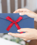 Hands holding blue envelope with red bow, Retro Invitation Envelopes Set, 10 Pack, 22x11cm, 250gsm Kraft Paper Envelopes For Greeting Cards